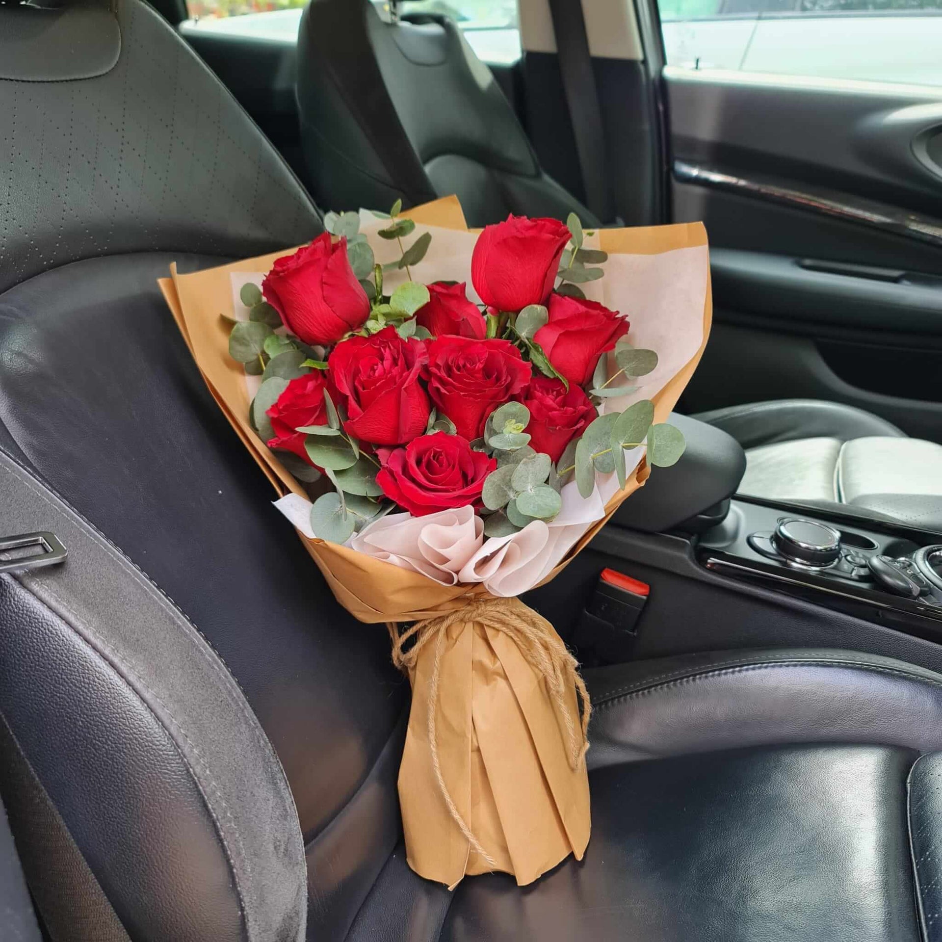 Majestic Roses Bouquet on a car seat