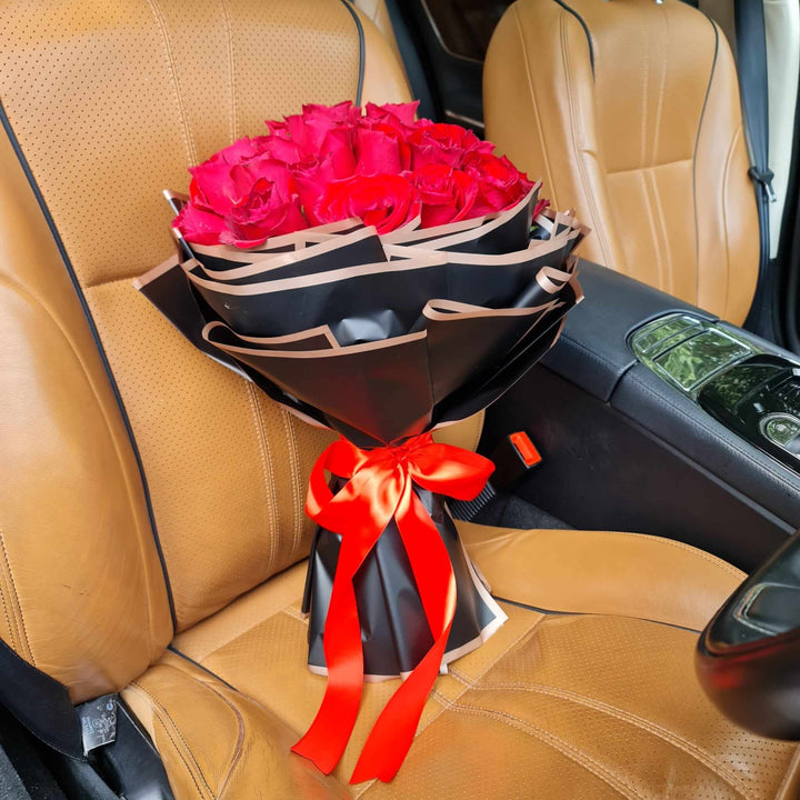 Pure Elegance Bouquet on a car seat