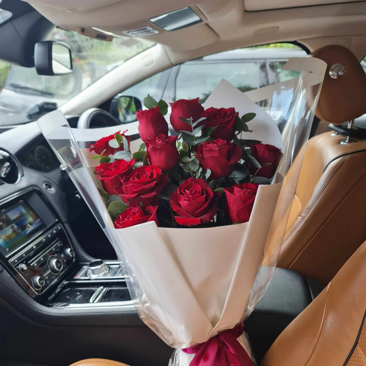 Romantic Red Roses Bouquet - A stunning arrangement of red roses in a car