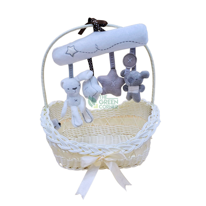 Bedbell toy arch over the keepsake basket from the Little Blossom baby girl hamper